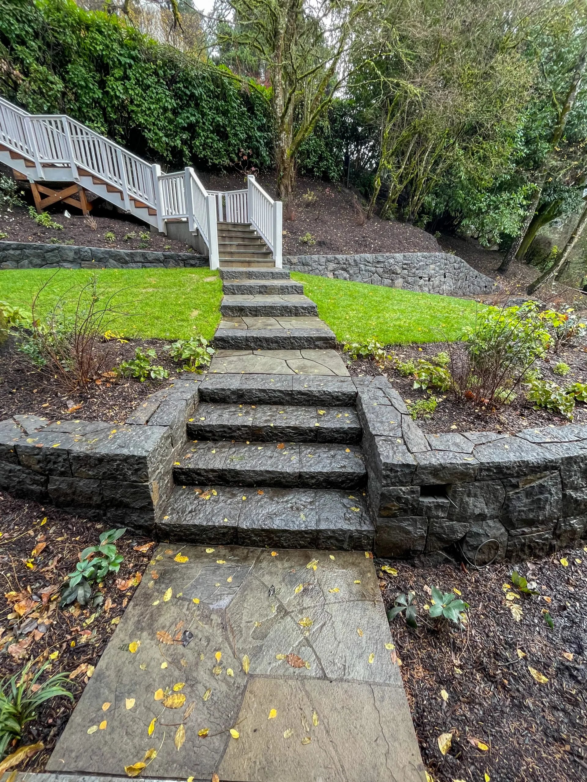 Natural stone masonry wall under construction